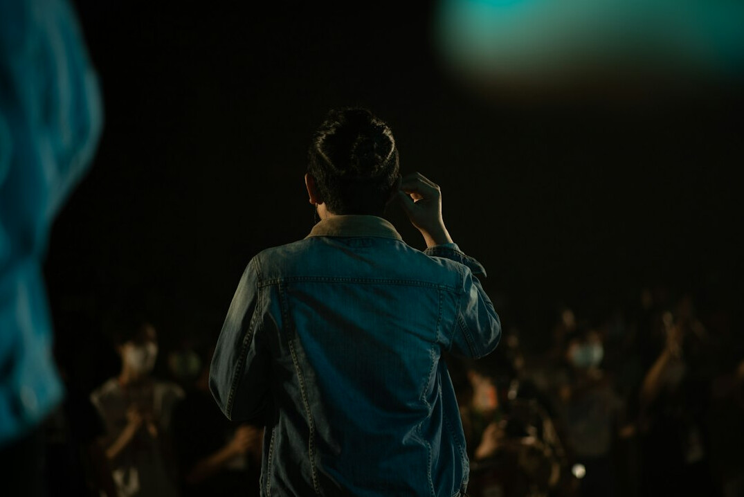 Broadcast director wearing a headset giving instructions during a live show